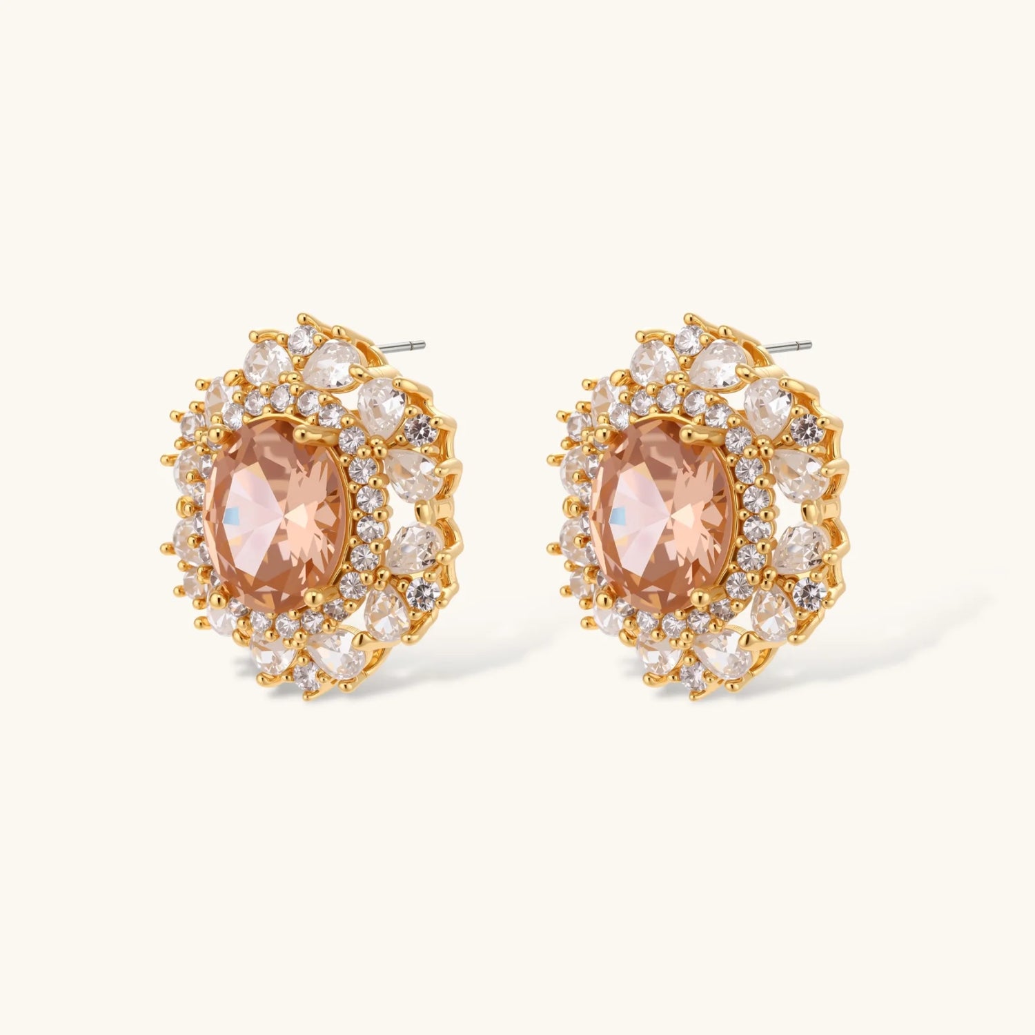 Ornate gold-plated jewelry set featuring peach center stone surrounded by clear AAA cubic zirconia crystals