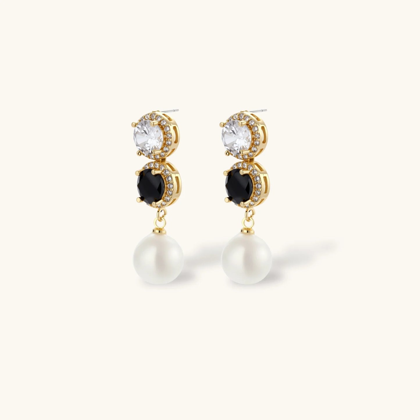 Gold-plated jewelry set with alternating black and clear cubic zirconia stones, featuring necklace, earrings and bracelet