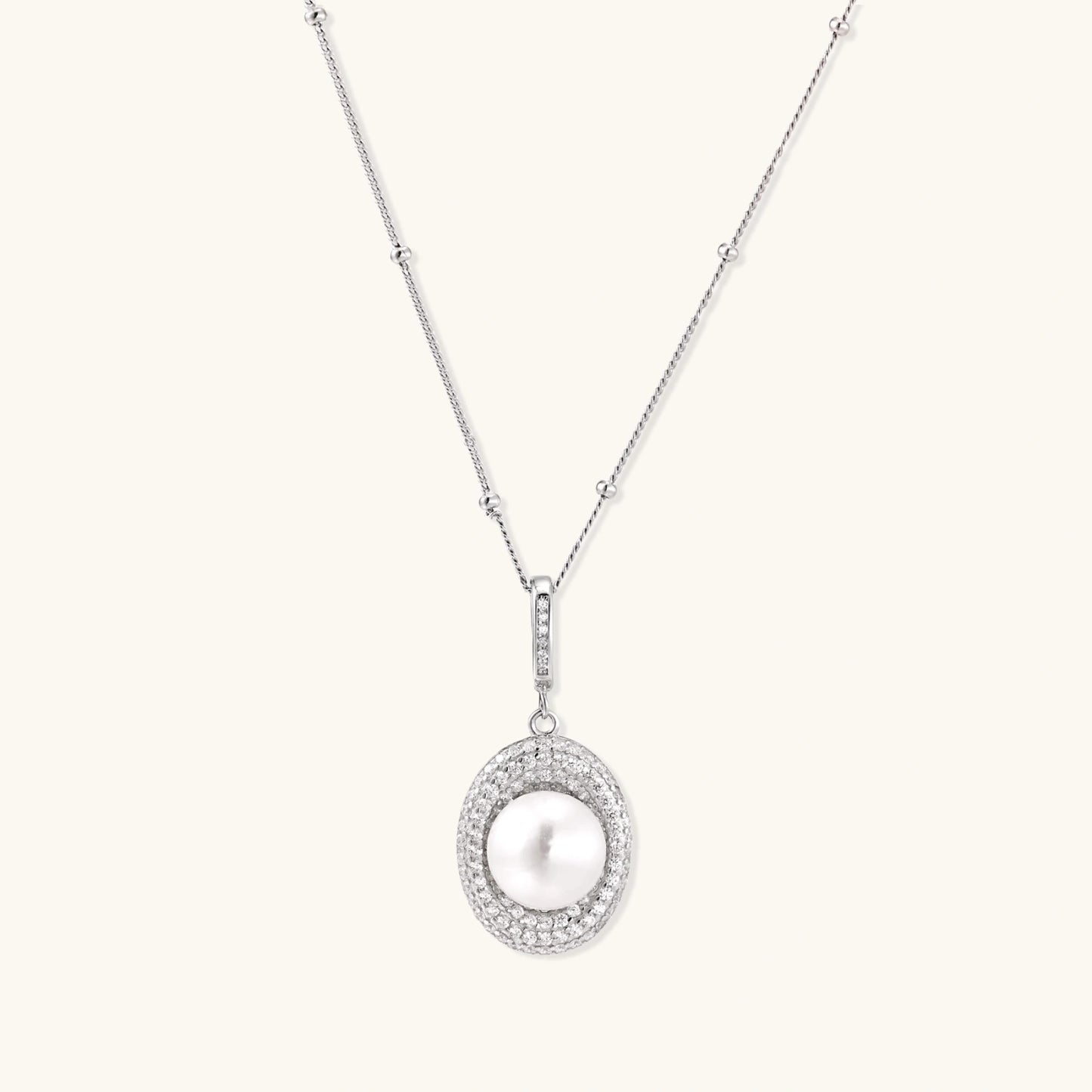 Silver pearl pendant necklace with freshwater pearl circled by pave crystal