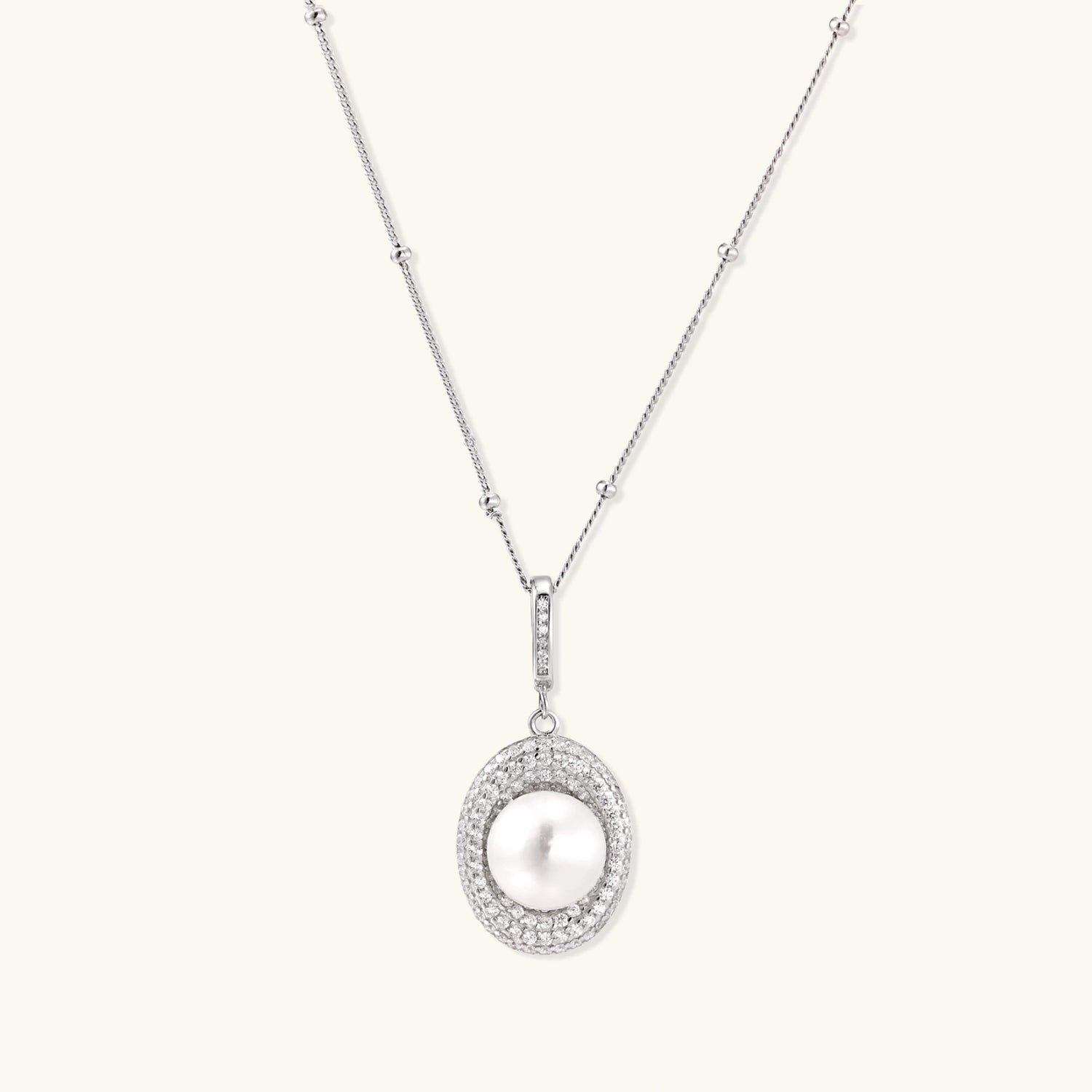 Silver pearl pendant necklace with freshwater pearl circled by pave crystal