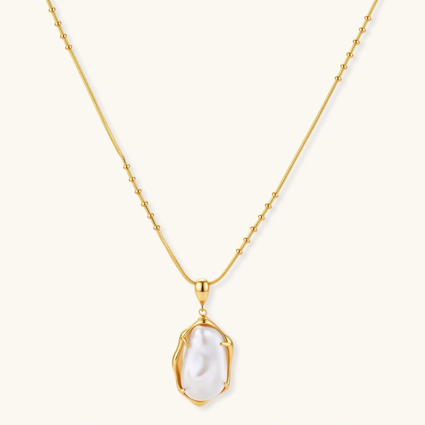 18K gold-plated sterling silver necklace with alternating bead chain and baroque pearl pendant on neutral background.